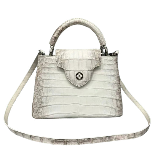 White Alligator skin handbag with a strap on a gray background