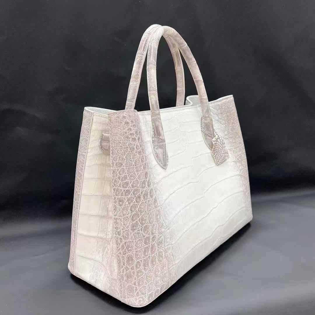 white Himalaya crocodile belly leather tote bag with structured silhouette and dual rolled handles