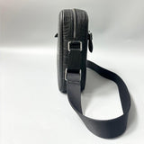 side view of alligator leather crossbody bag showing structured profile and strap attachment