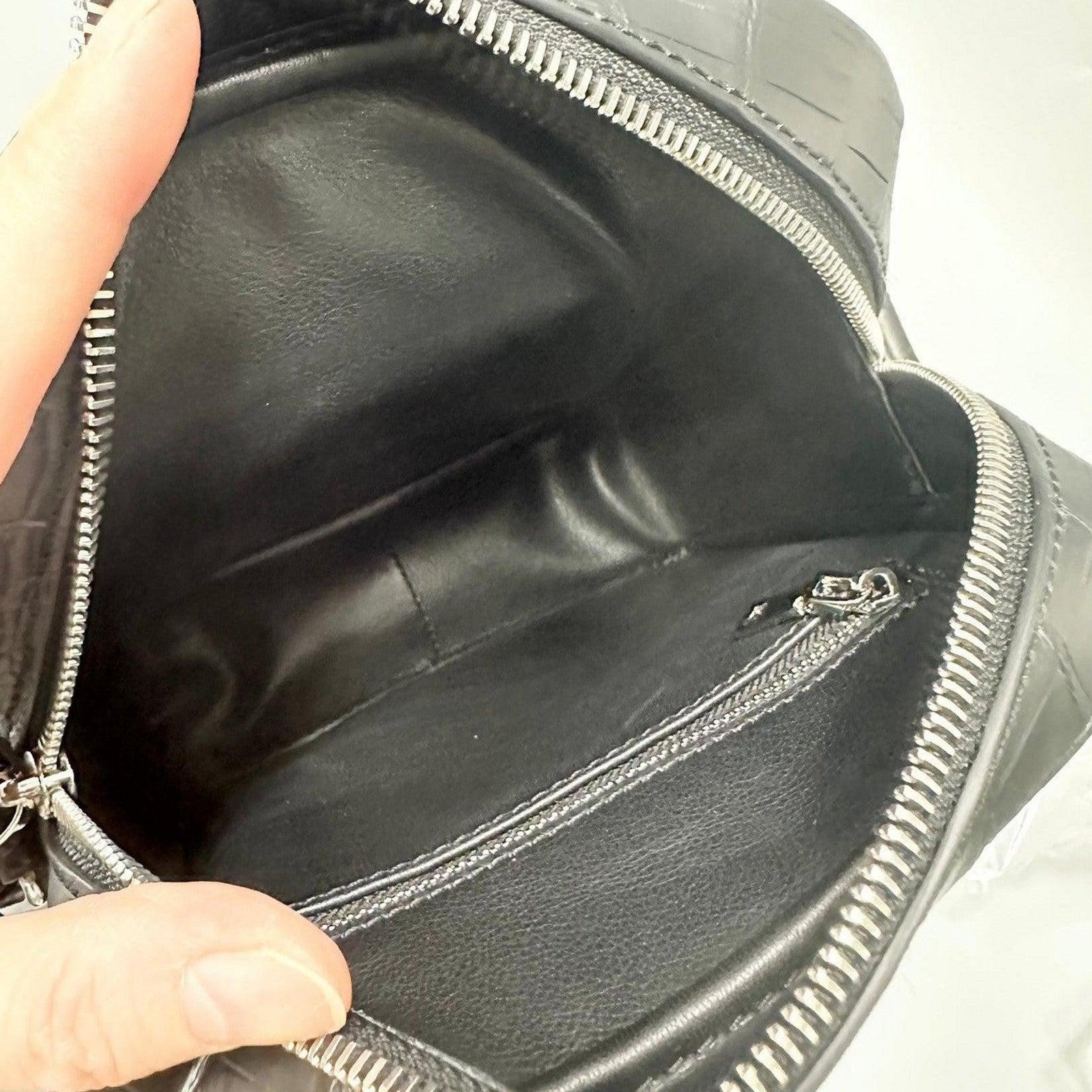 interior view of alligator leather crossbody bag showing leather lining and zip pocket
