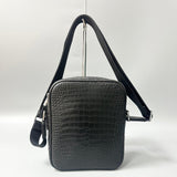 alligator leather crossbody bag hanging view showing adjustable strap and overall shape
