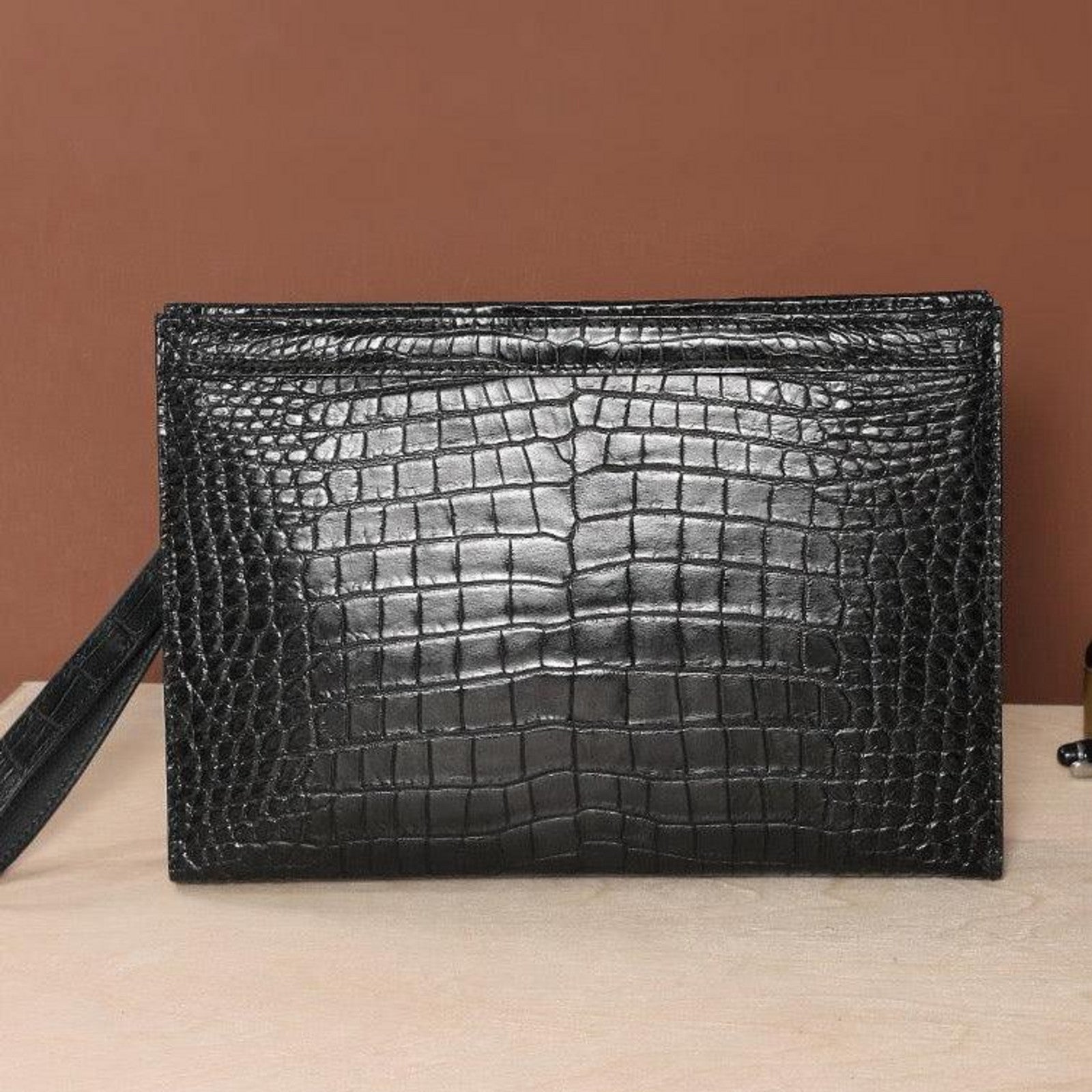 black genuine alligator belly leather men's clutch front angled view