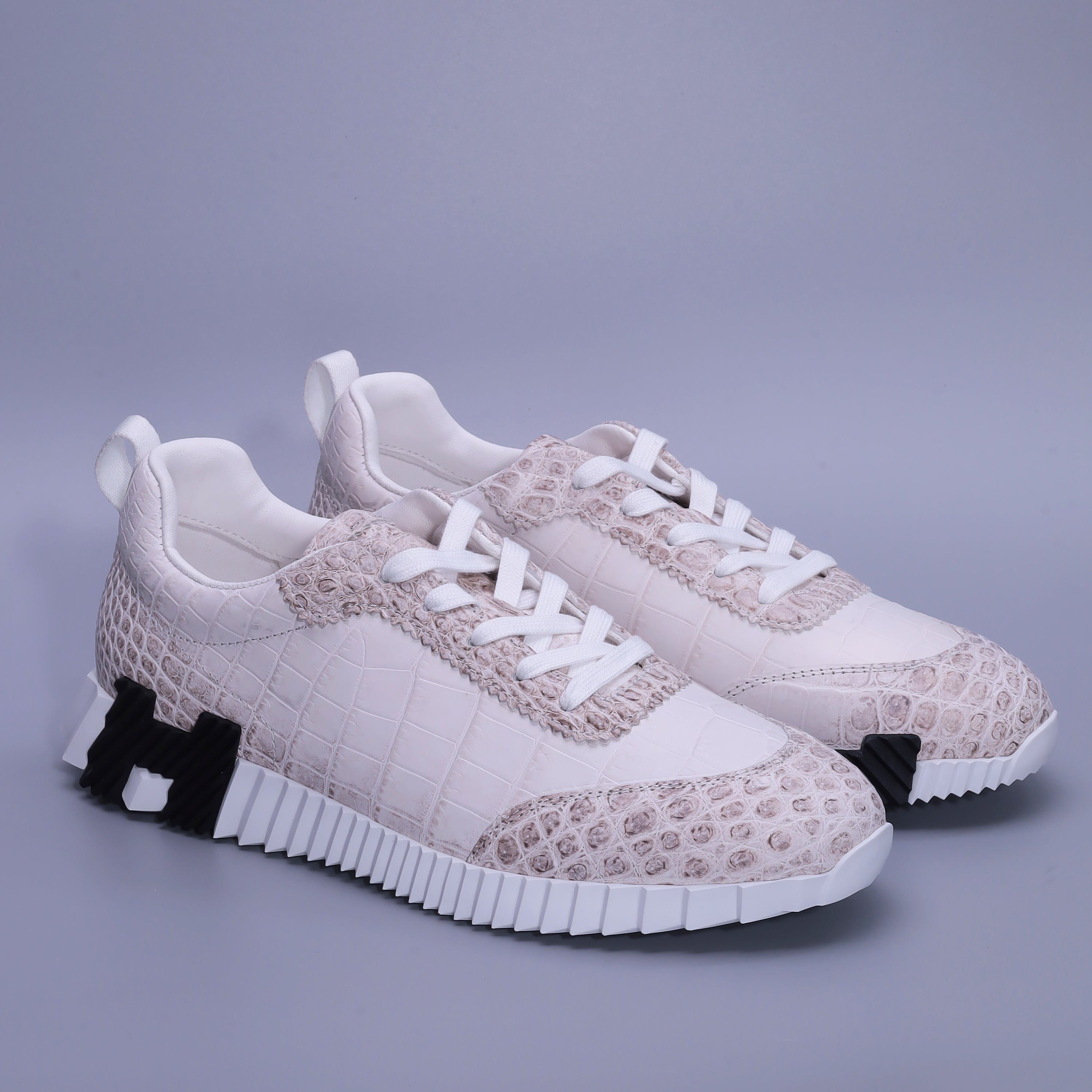 Himalayan Alligator leather men’s lace-up sneakers in white ivory with contrasting large and small natural scale patterns.