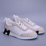 Himalayan Alligator leather men’s lace-up sneakers in white ivory with contrasting large and small natural scale patterns.